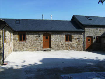 Stone House View after using reclaimed brick and lime mortar to renovate.