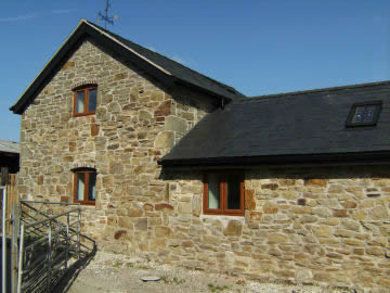Stone House View after using reclaimed brick and lime mortar to renovate.