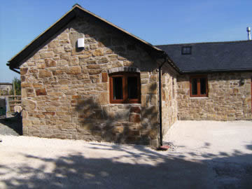 Stone House View after using reclaimed brick and lime mortar to renovate.