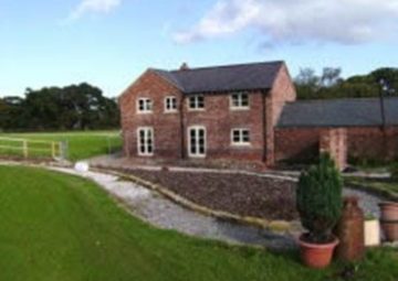 Renovated Brick House that has been repointed and touched up.